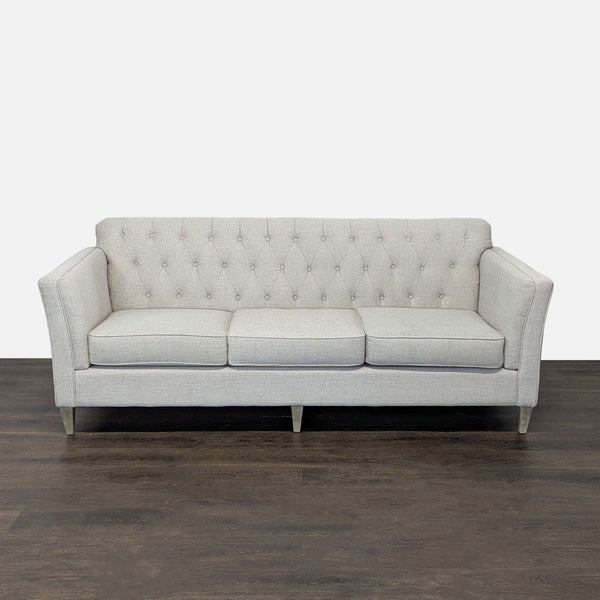 La-Z-Boy 3-seat sofa with tufted backrest, light beige fabric, slim arms, and wooden legs for a modern look.