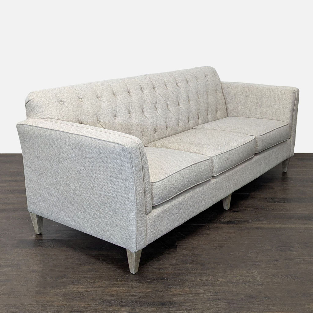 Modern La-Z-Boy three-seater in neutral beige, featuring supportive cushions, clean lines, and sturdy wooden legs.