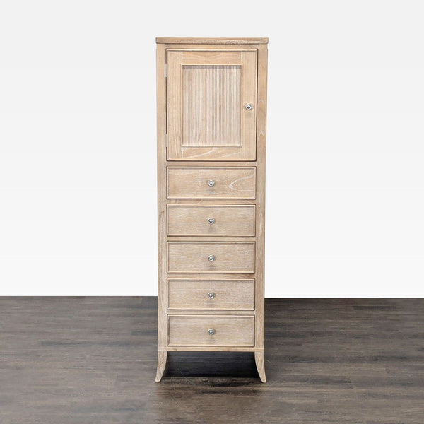 Tall Arhaus dresser with light wood finish, five drawers, and a mirrored top cabinet for jewelry storage.