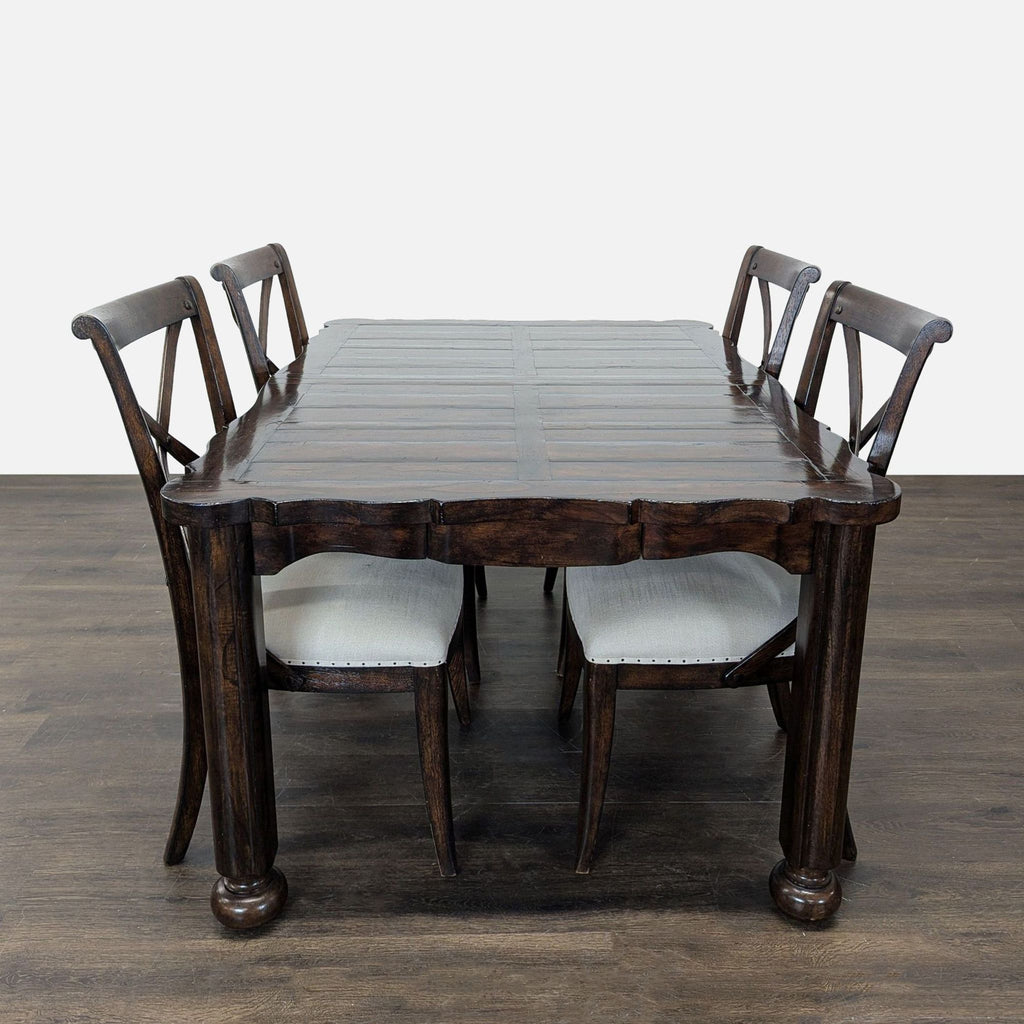 Stanley Furniture European Farmhouse dining set with rectangular planked table and four upholstered X-back chairs.