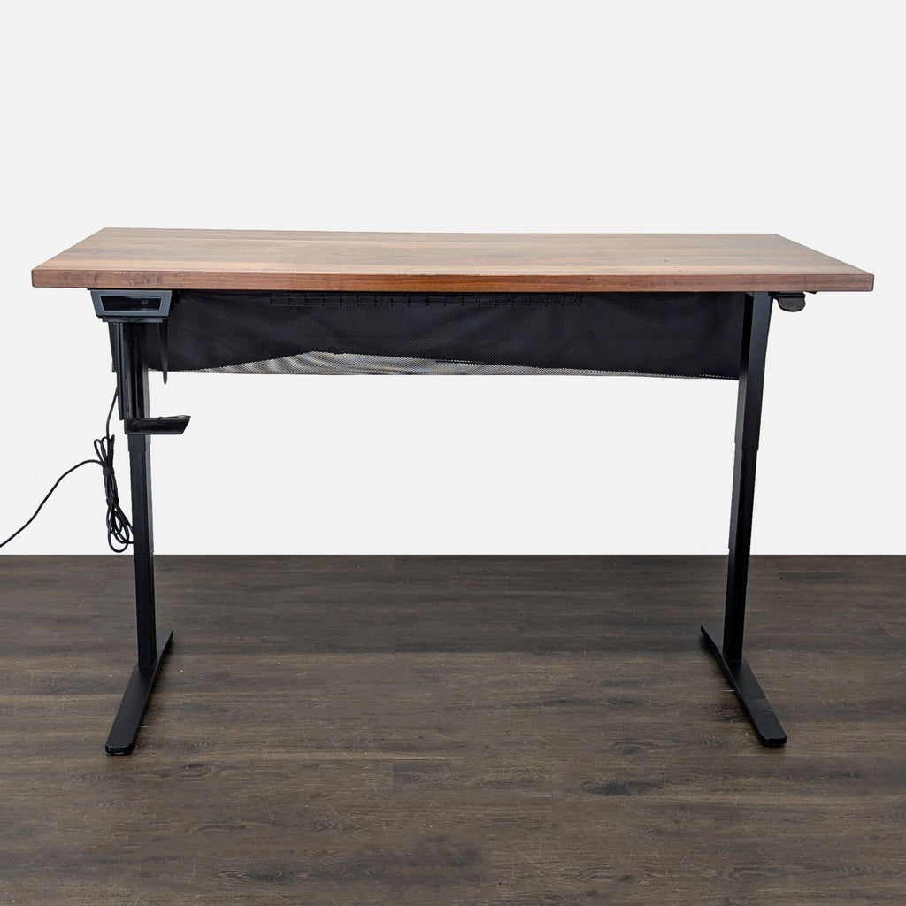 Premium UPLIFT electric standing desk with large solid wood top, dual motors, and cable management hammock.
