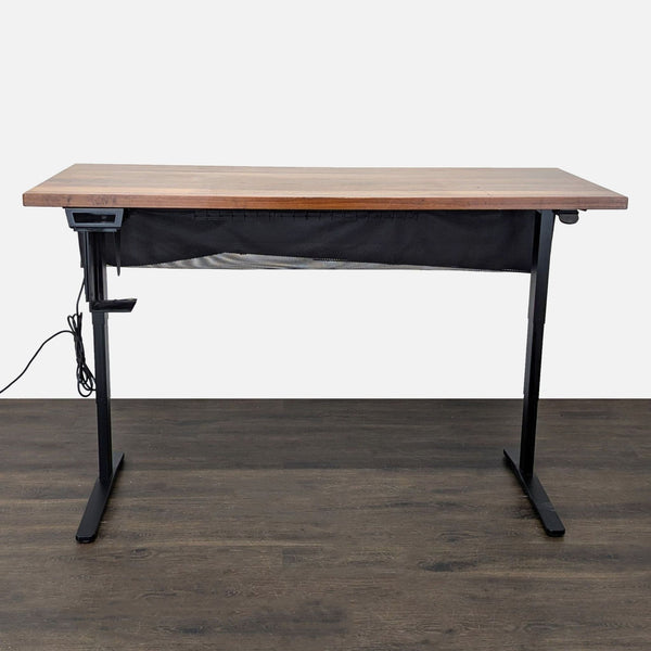 Premium UPLIFT electric standing desk with large solid wood top, dual motors, and cable management hammock.