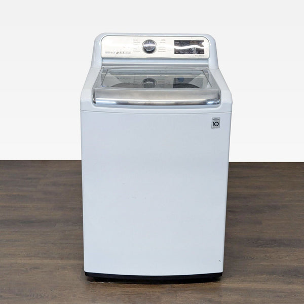 LG top load washer with glass lid, stainless steel drum, and intuitive controls, suitable for busy families.