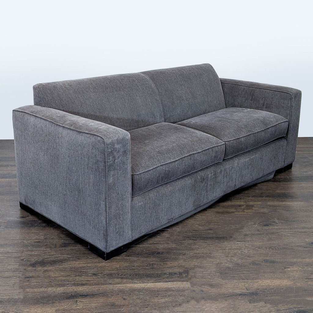 Stylish McCreary Modern sleeper sofa in gray fabric, featuring sturdy build and wide, inviting armrests.