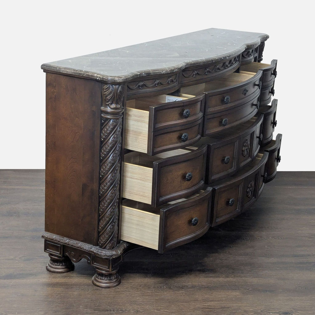 Elegant brown Ashley dresser with marble top and spacious drawers, perfect for stylish bedroom storage.