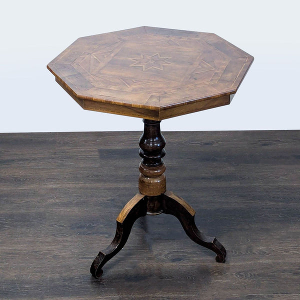 End table featuring an inlaid tabletop with a central star design and pedestal base.  