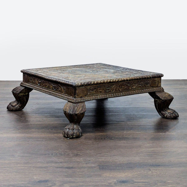 Hand-carved coffee table with intricate floral wood and metal design, crafted in Northern California.
