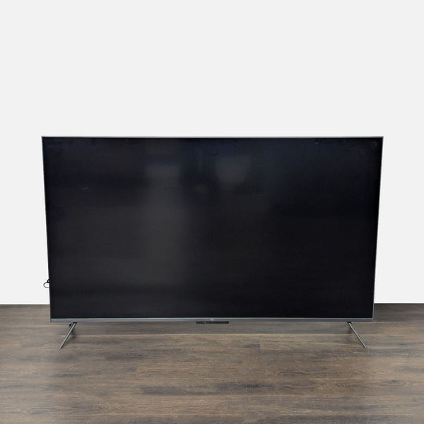 Amazon 75-inch 4K Ultra HD Smart TV with slim design and sturdy legs, ideal for home entertainment.  