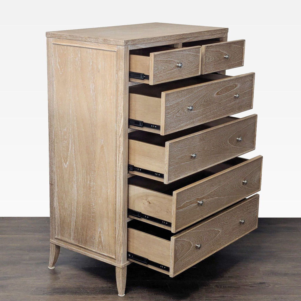 Arhaus modern dresser in light wood finish, featuring six spacious drawers and sturdy, stylish curved feet.