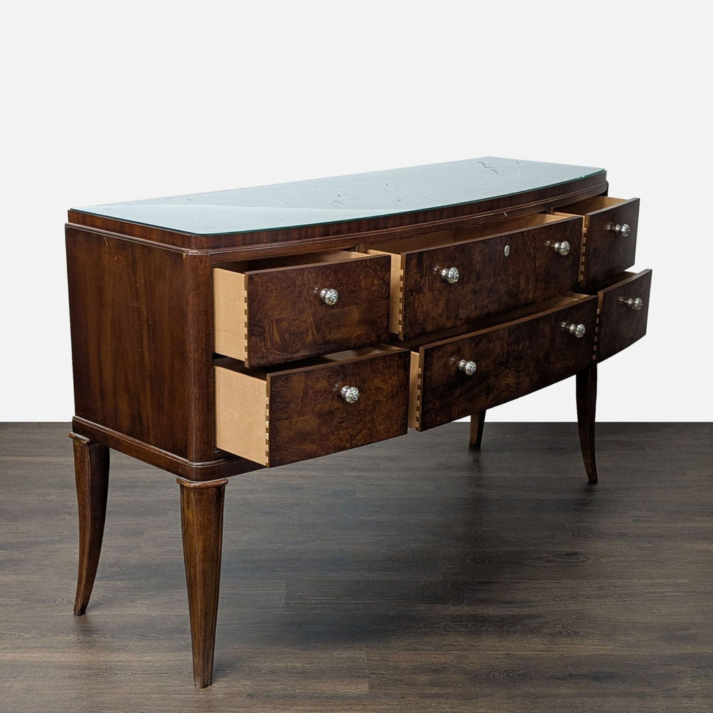 Elegant Thomasville dresser featuring matched burl veneer, gently curved front, tapered legs, and metal pulls.
