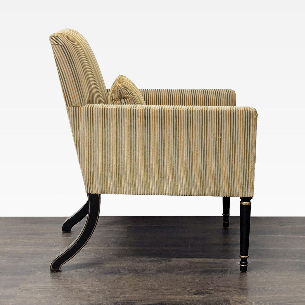 High-end Dessin Fournir lounge chair featuring tall upholstered back, tailored arms, and ebonized saber legs with gold.