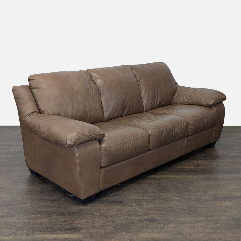Italsofa sofa in soft brown leather, featuring generous padding and a sturdy, contemporary design for comfort.
