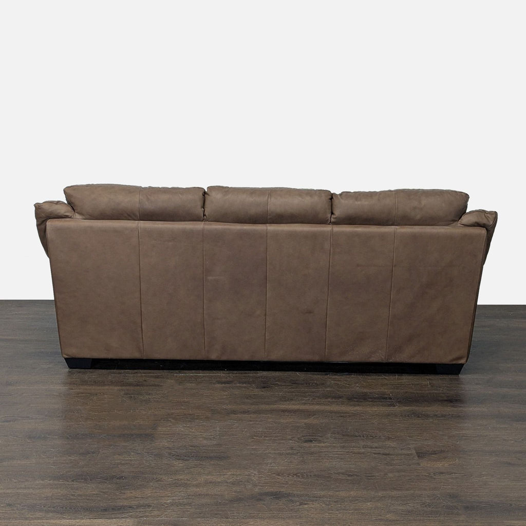 Modern Italsofa three-seater with cozy brown leather upholstery and thickly padded seats and arms.
