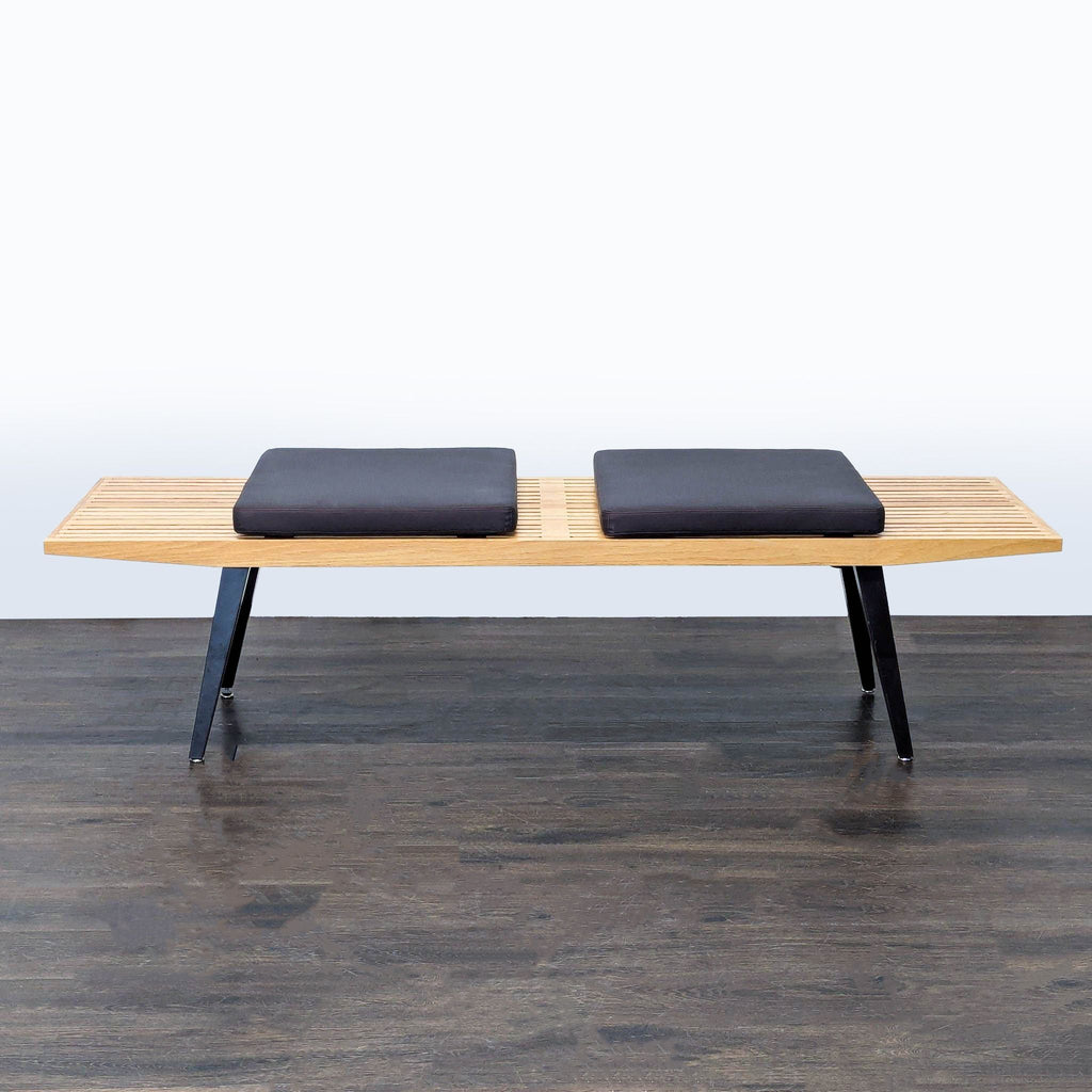 Angled tapered metal legs attached to the base of a stool, ottoman, or bench.