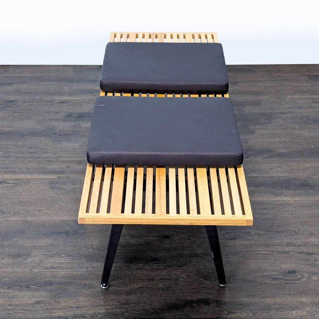 Stool, ottoman, or bench base fitted with angled, slim, tapering metal legs.