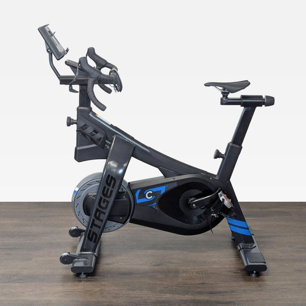 Stages Cycling indoor exercise bike with adjustable seat and handlebars, durable frame, and smooth-ride design.