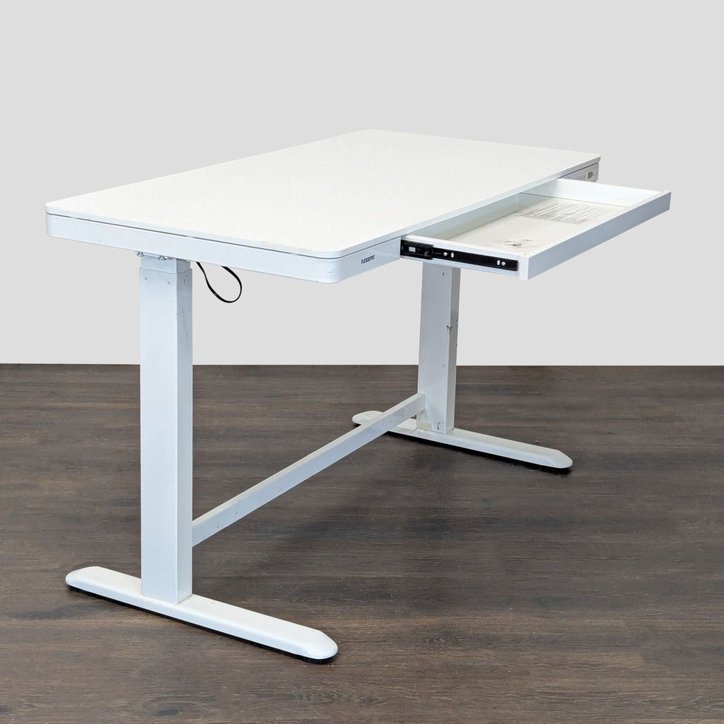 Flexispot electric standing desk in white, featuring a built-in drawer and control panel for easy, ergonomic adjustments.