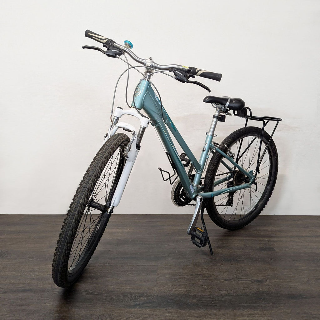 Lightweight Giant bicycle featuring reliable brakes, front suspension, and gear rack; perfect for outdoor activities.  