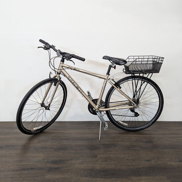 A Trek 7.2 FX bicycle with a lightweight frame is displayed outdoors, highlighting its sleek design.