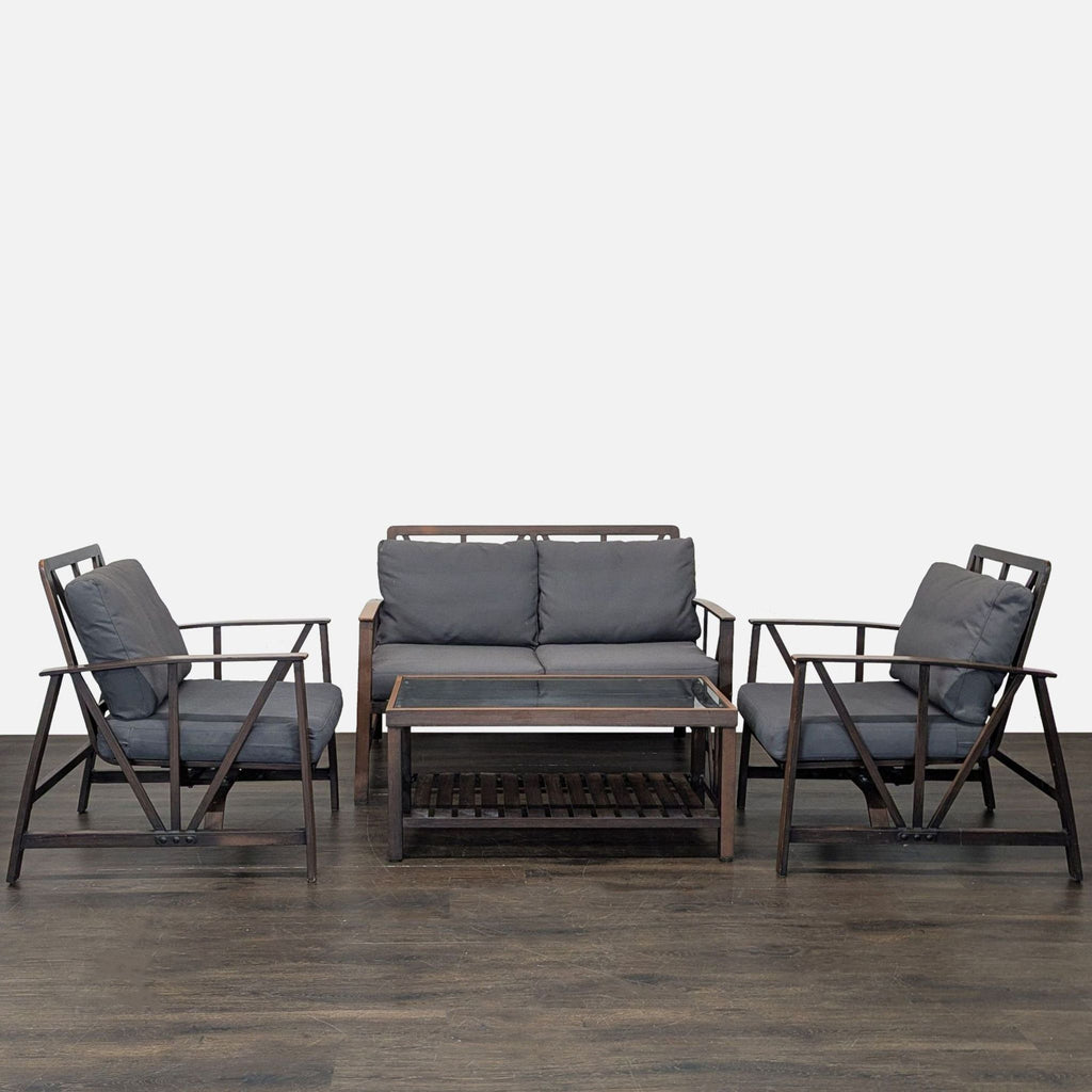 Orchard set with a sofa, two armchairs, and coffee table in dark wood and gray cushions, ideal for patios.