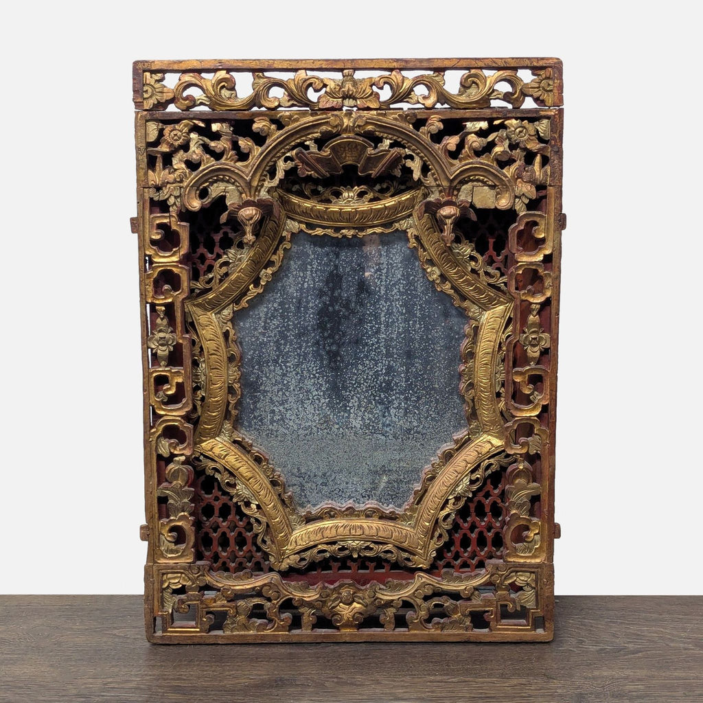 Hand-carved red lacquer and gold panel with ornate designs, from an antique mirror.