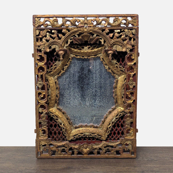 Hand-carved red lacquer and gold panel with ornate designs, from an antique mirror.