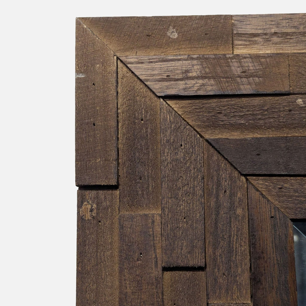 2. Artistic mirror framed in carved, layered wood creating a striking 3D effect.  