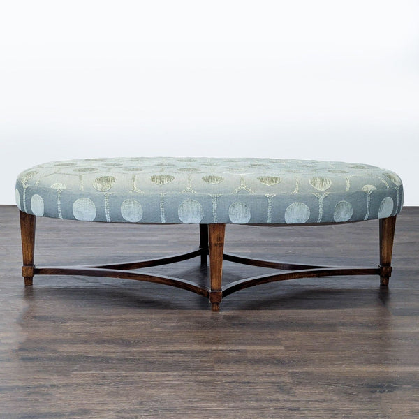 Ornate cut velvet upholstered bench with wooden base and stretcher, used as a decorative stool or ottoman.  