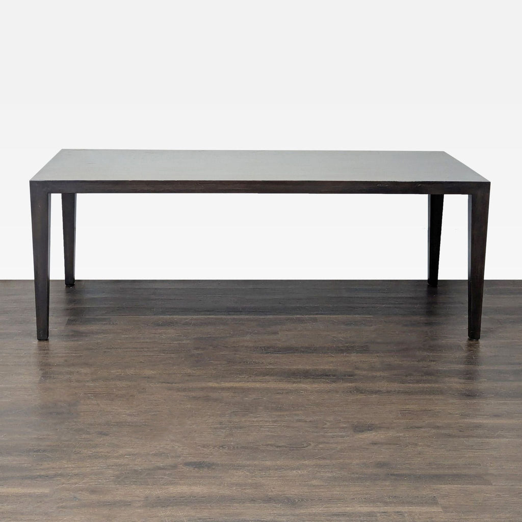 Room & Board bamboo dining table with sleek, tapered legs.