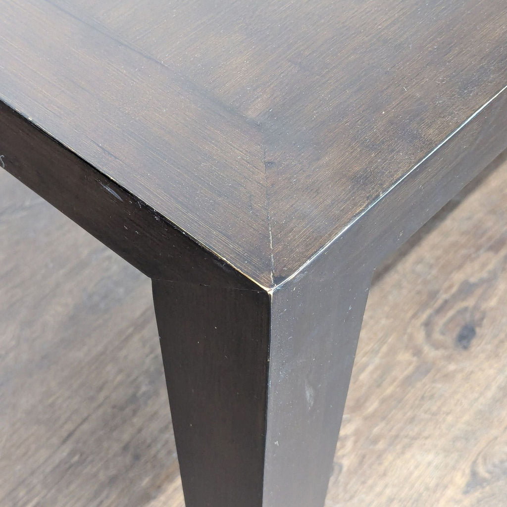 Modern bamboo dining table by Room & Board, featuring elegant tapered legs.