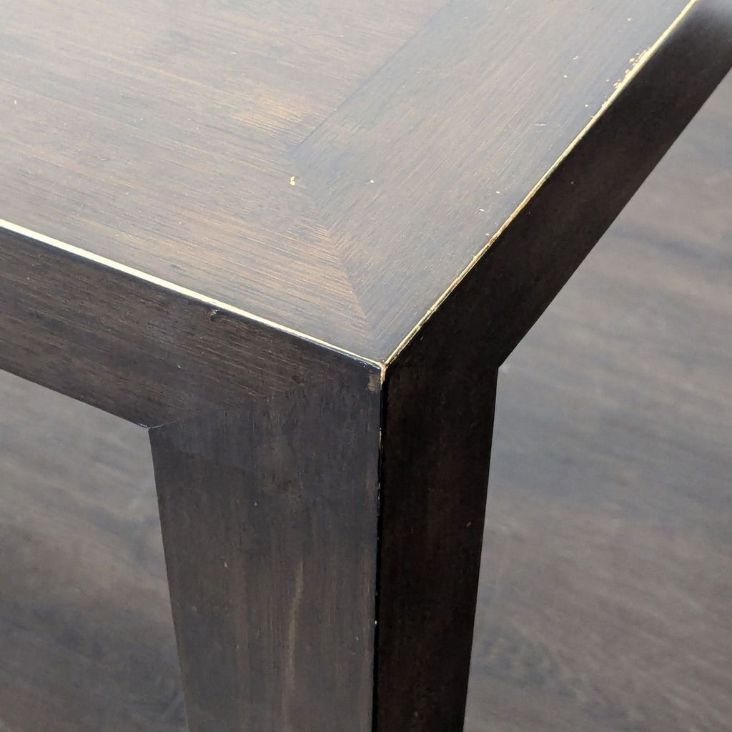 Dining table made of bamboo with gently tapered legs, brand Room & Board.