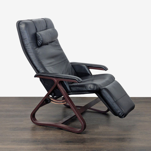 Black leather Relax The Back lounge chair with wooden frame, recliner, and padded armrests.