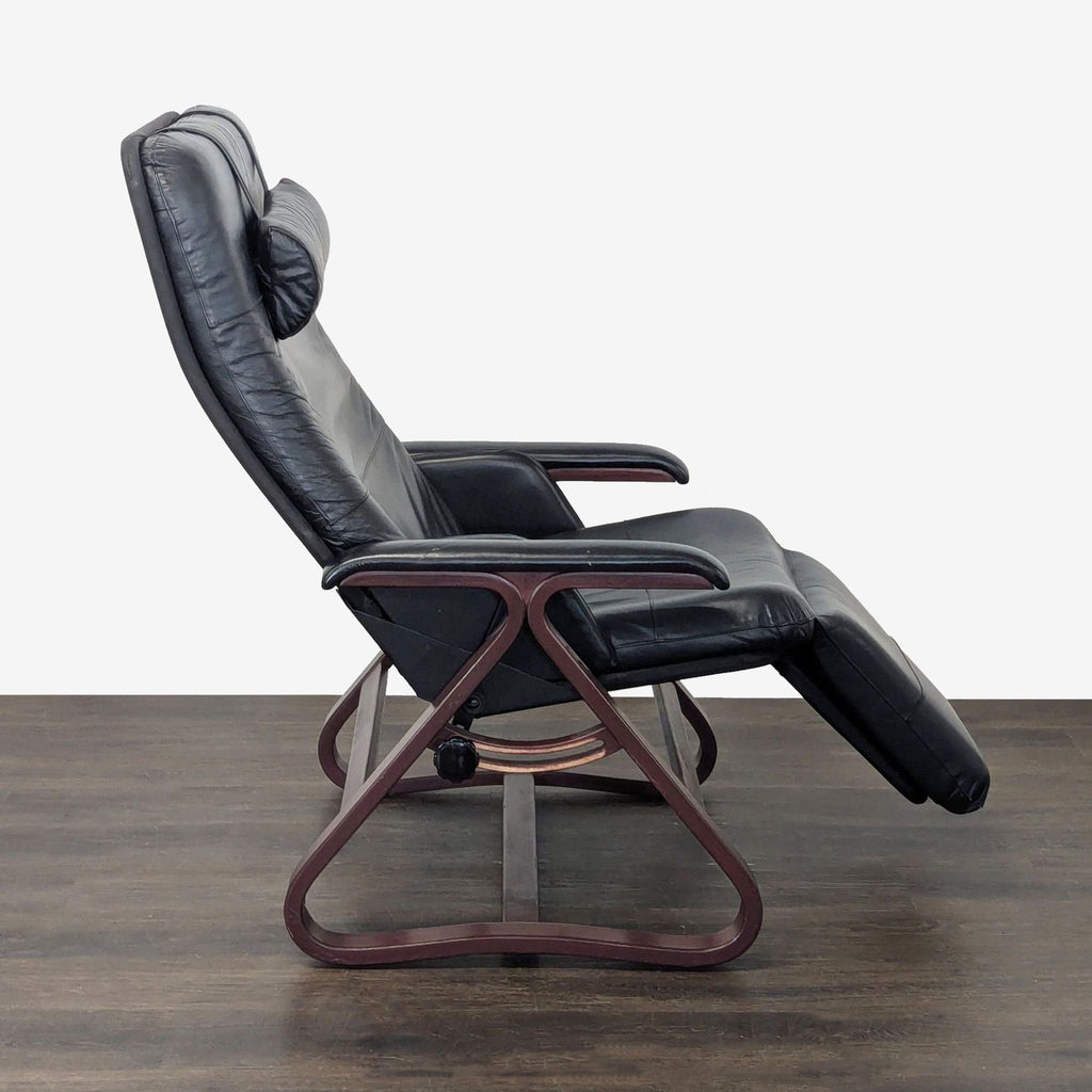 Comfortable black leather Relax The Back chair with adjustable recline, ideal for home or office relaxation.
