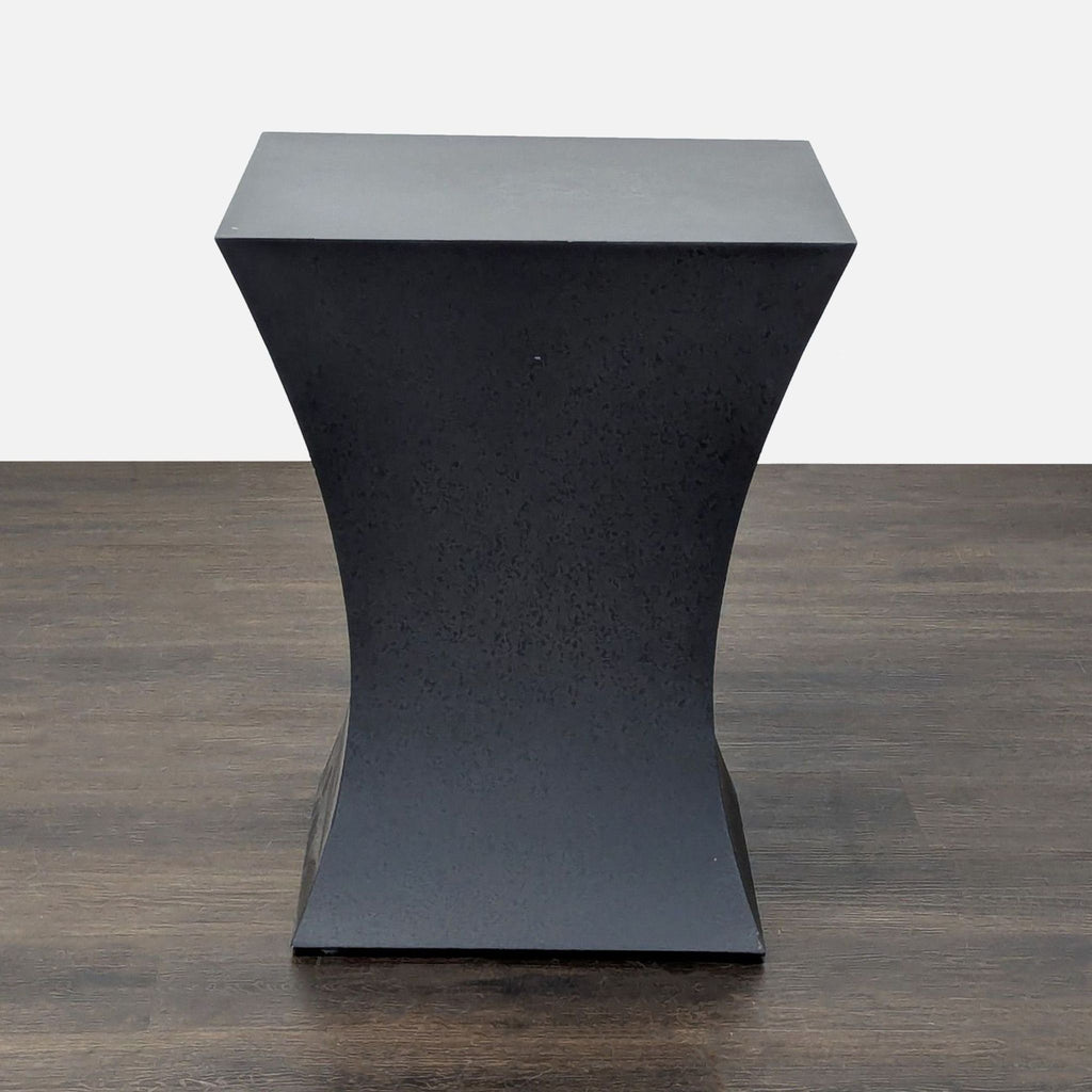 Modern natural steel Room & Board end table, sturdy construction and understated elegance.