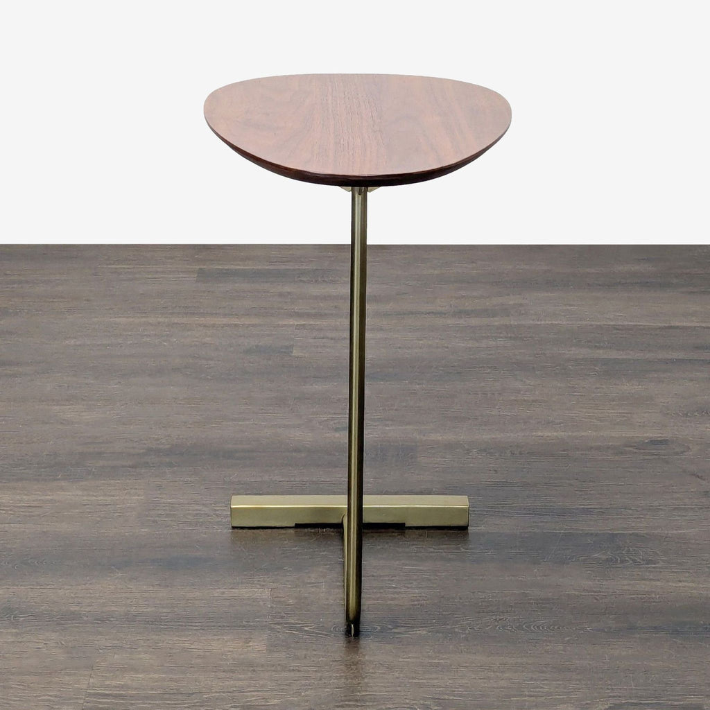2. Modern console table featuring a walnut top and brass base, from West Elm’s side table collection.