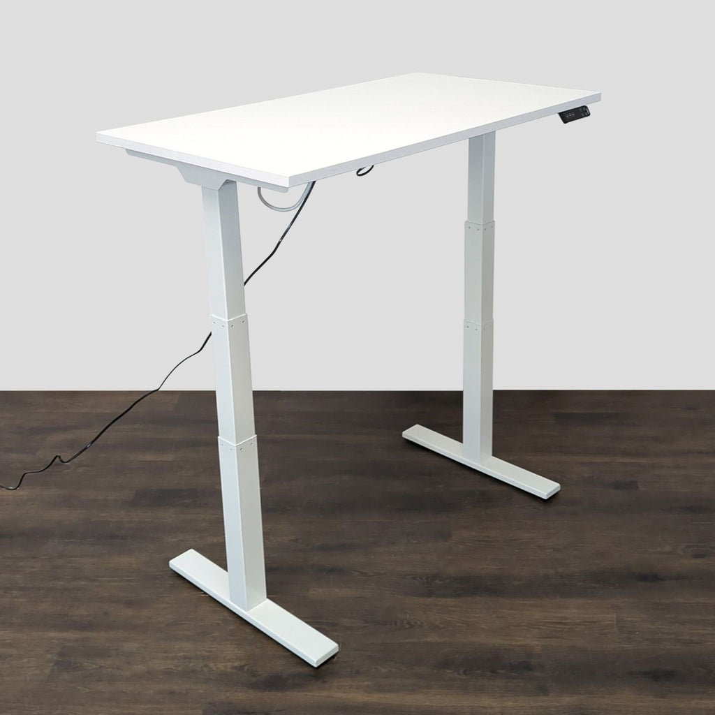 Modern Poppin desk in clean white, featuring sturdy construction and effortless electric height adjustment.  