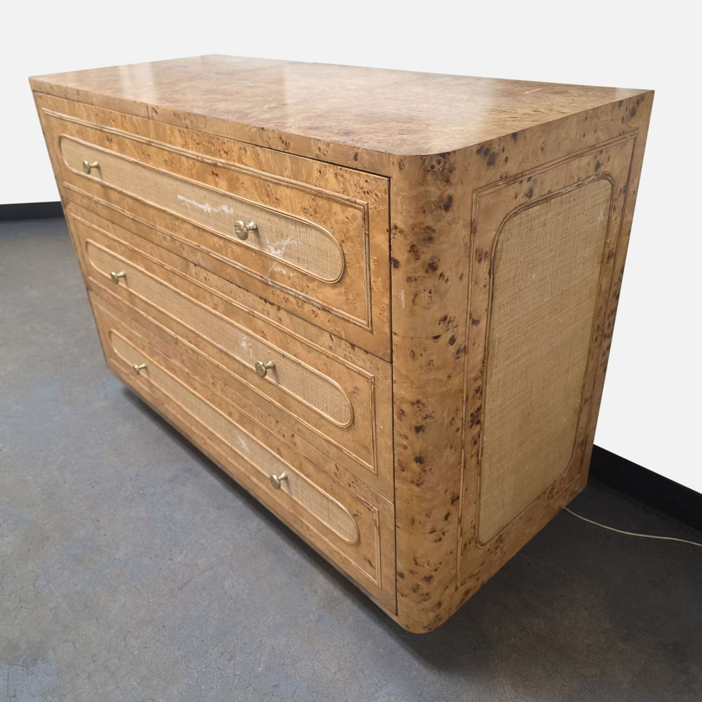 Made Goods Beaumont dresser with mappa burl top, raffia drawers, gold hardware, and curved sides.
