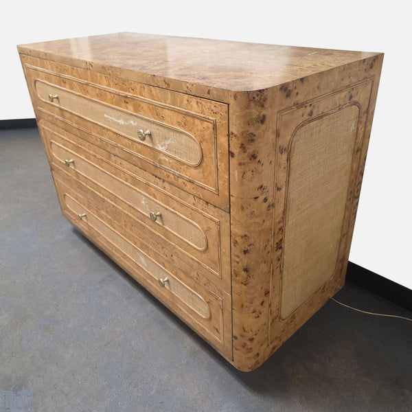 Made Goods Beaumont dresser with mappa burl top, raffia drawers, gold hardware, and curved sides.