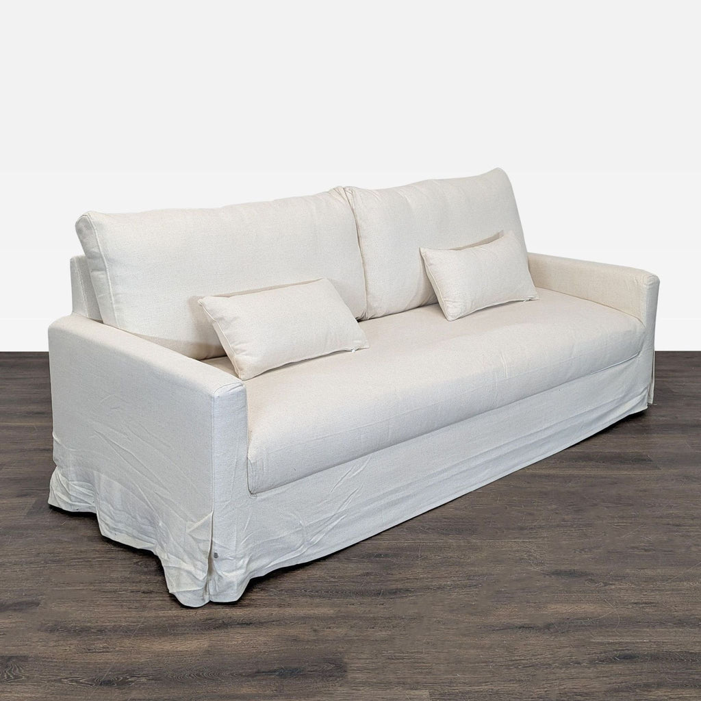 Modern beige Ikea 3-seater sofa featuring spacious seating, soft fabric cover, and sturdy construction.