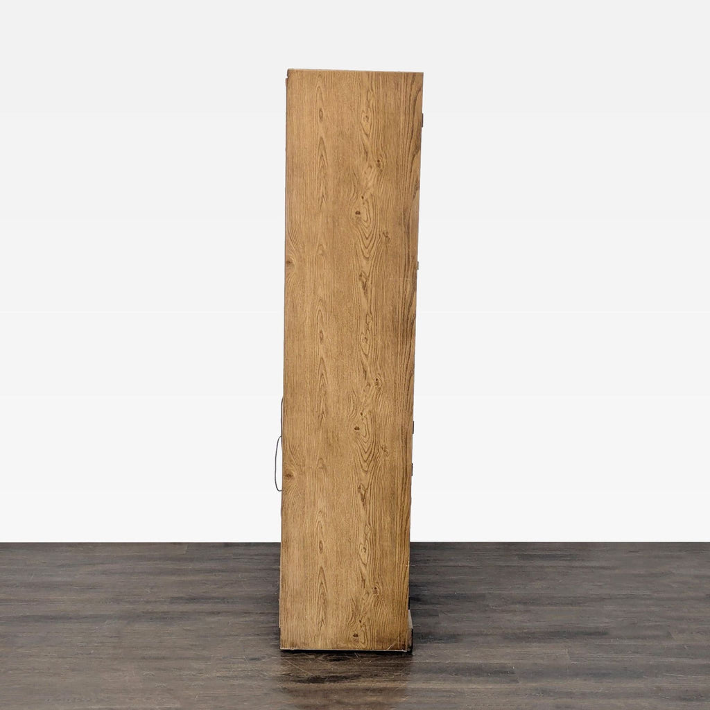 Cabinet made of wood, includes interior lighting, glass shelves, and spacious storage areas.