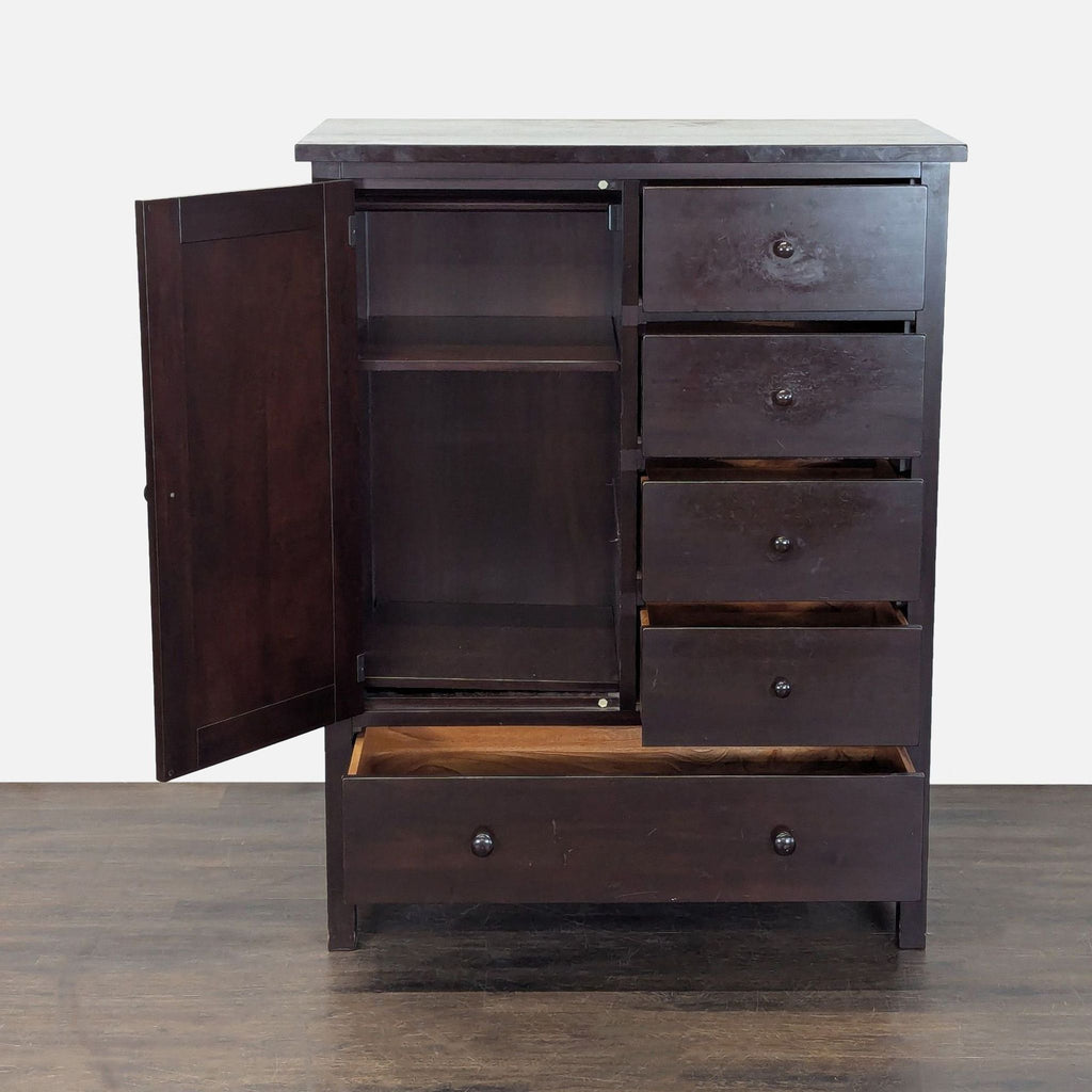 Classic Pottery Barn dresser in dark wood, featuring multiple drawers and a cabinet for organized bedroom storage.