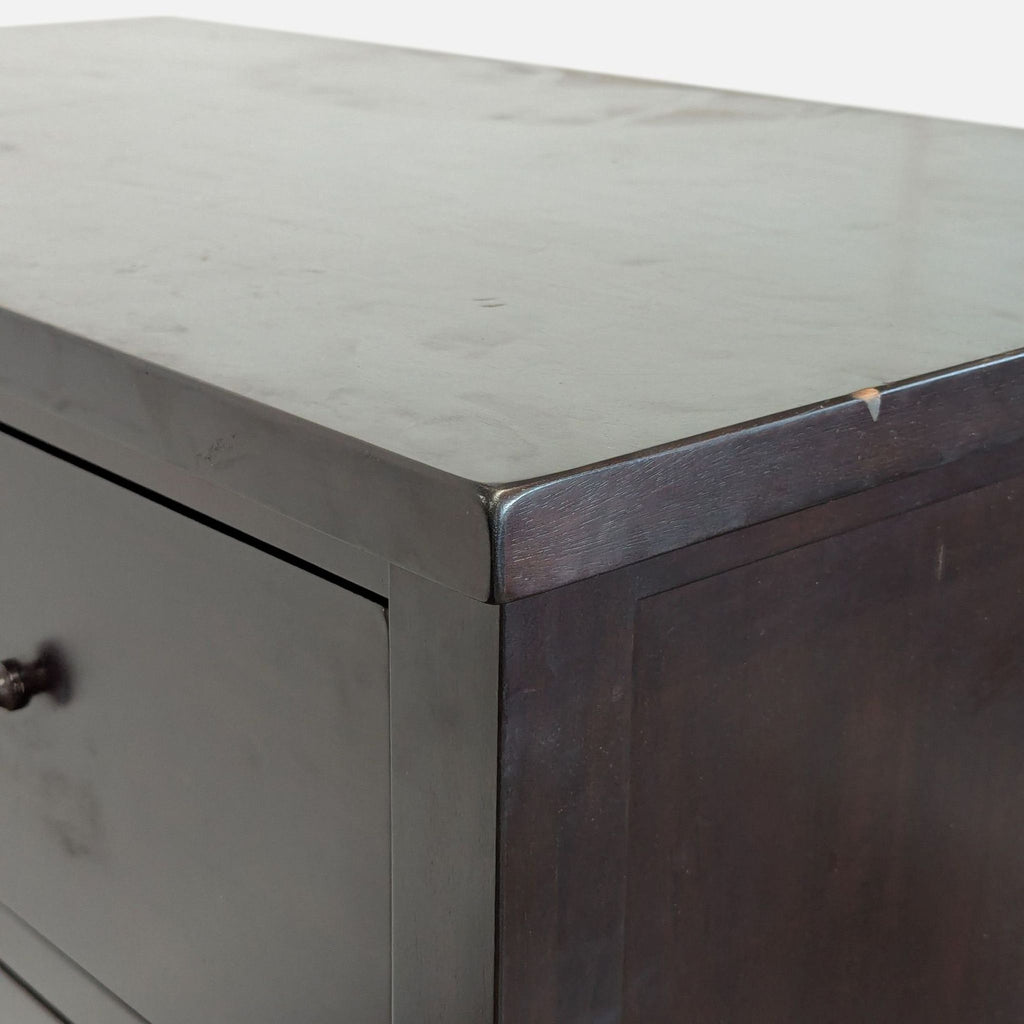Sturdy dresser by Pottery Barn with spacious drawers and a side cabinet, ideal for versatile bedroom organization.