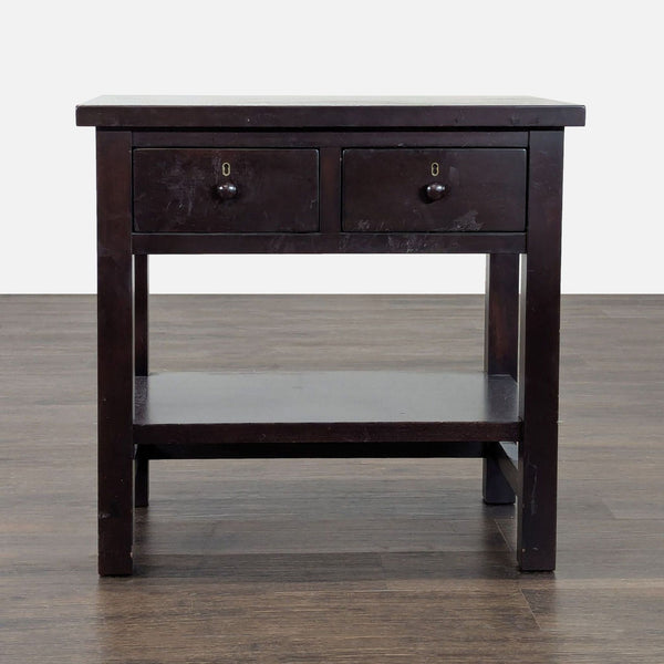 Pottery Barn end table with two drawers, lower shelf, and dark wood finish, perfect for bedside storage.