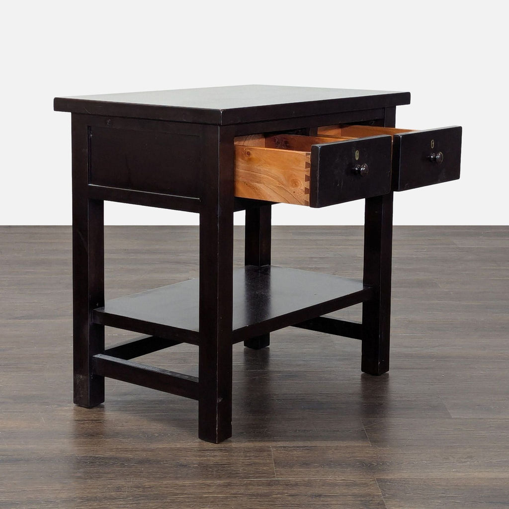 Dark wood Pottery Barn nightstand featuring dual drawers and open lower shelf, ideal for organizing essentials.
