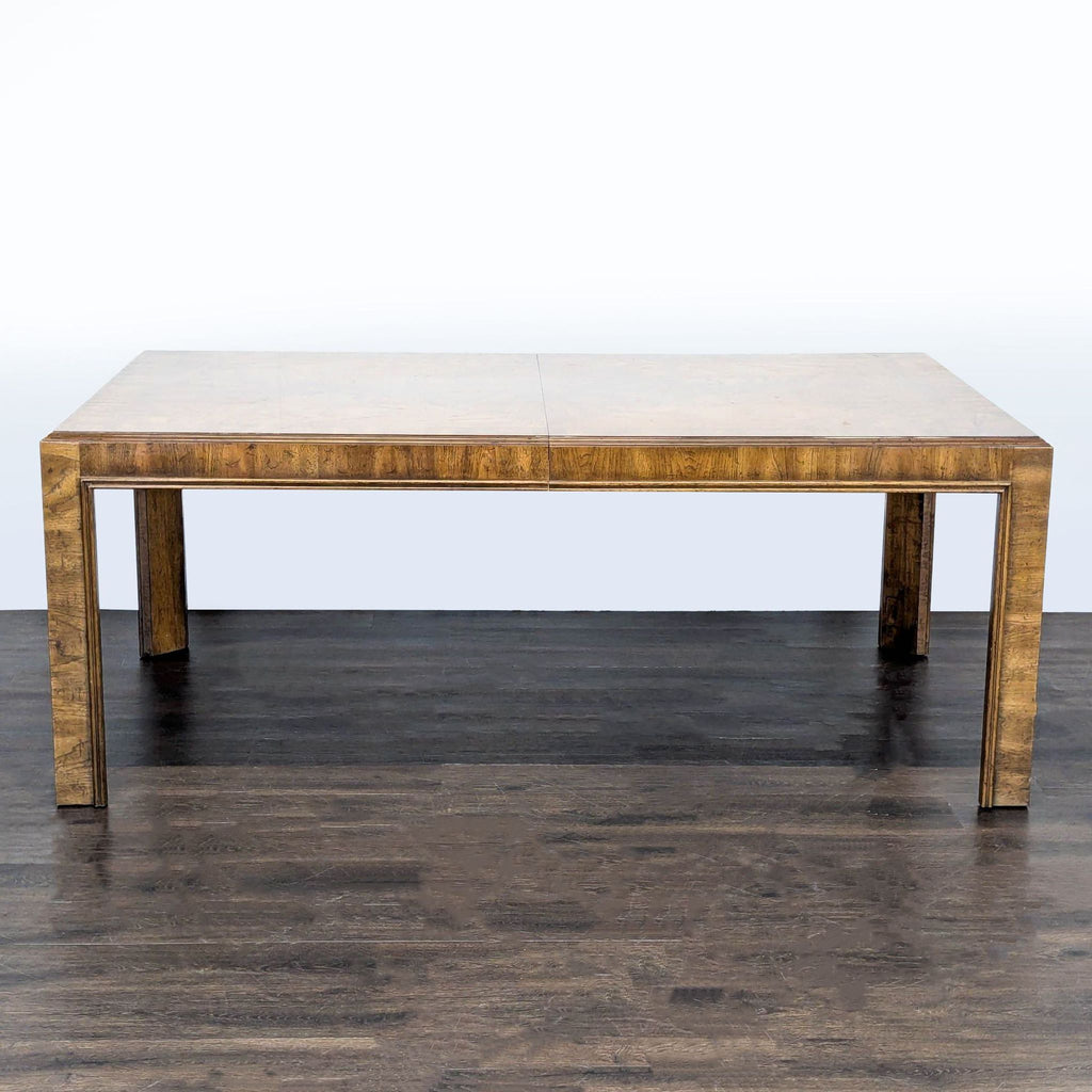 2. Drexel Heritage wood dining table with a simple rectangular design and straight, block-style legs.