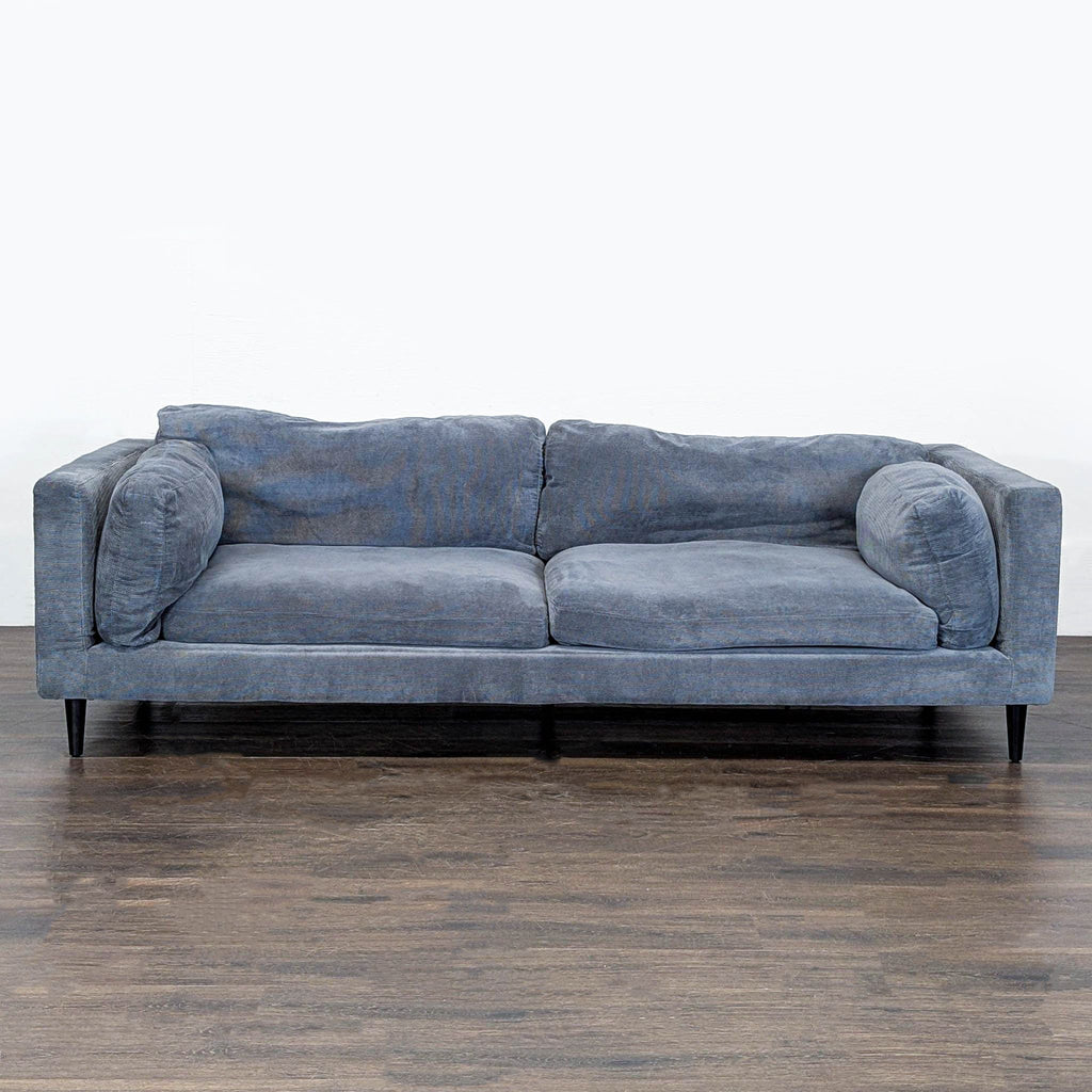 1. Modern 3-seat blue sofa from Moe's Home Collection, with deep cushions and slim black legs, front view.
