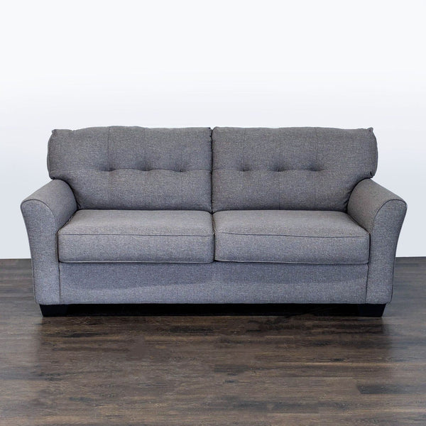 Ashley Furniture sleeper sofa in very good condition, barely used, shown in a living room setting.  