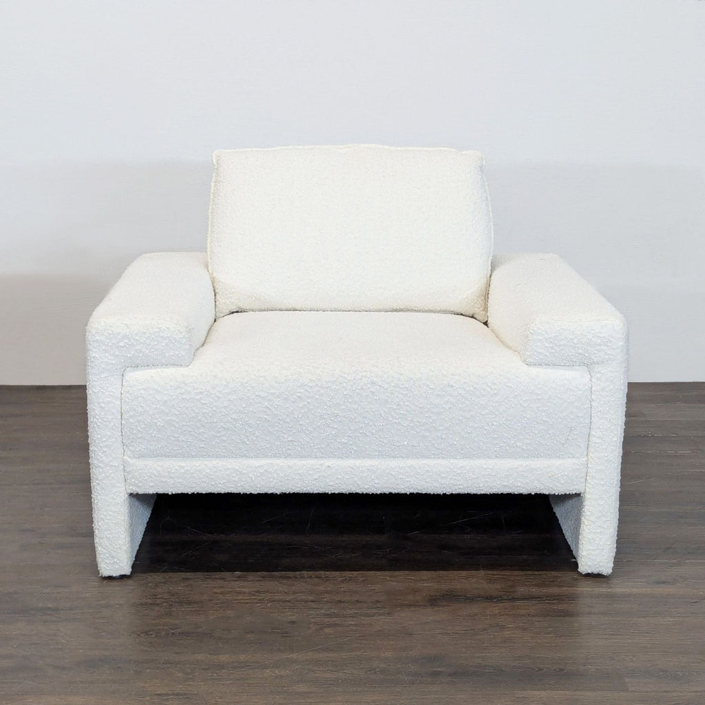 Modern bouclé lounge chair with wide armrests and plush cushions by TOV Furniture, perfect for relaxing.  