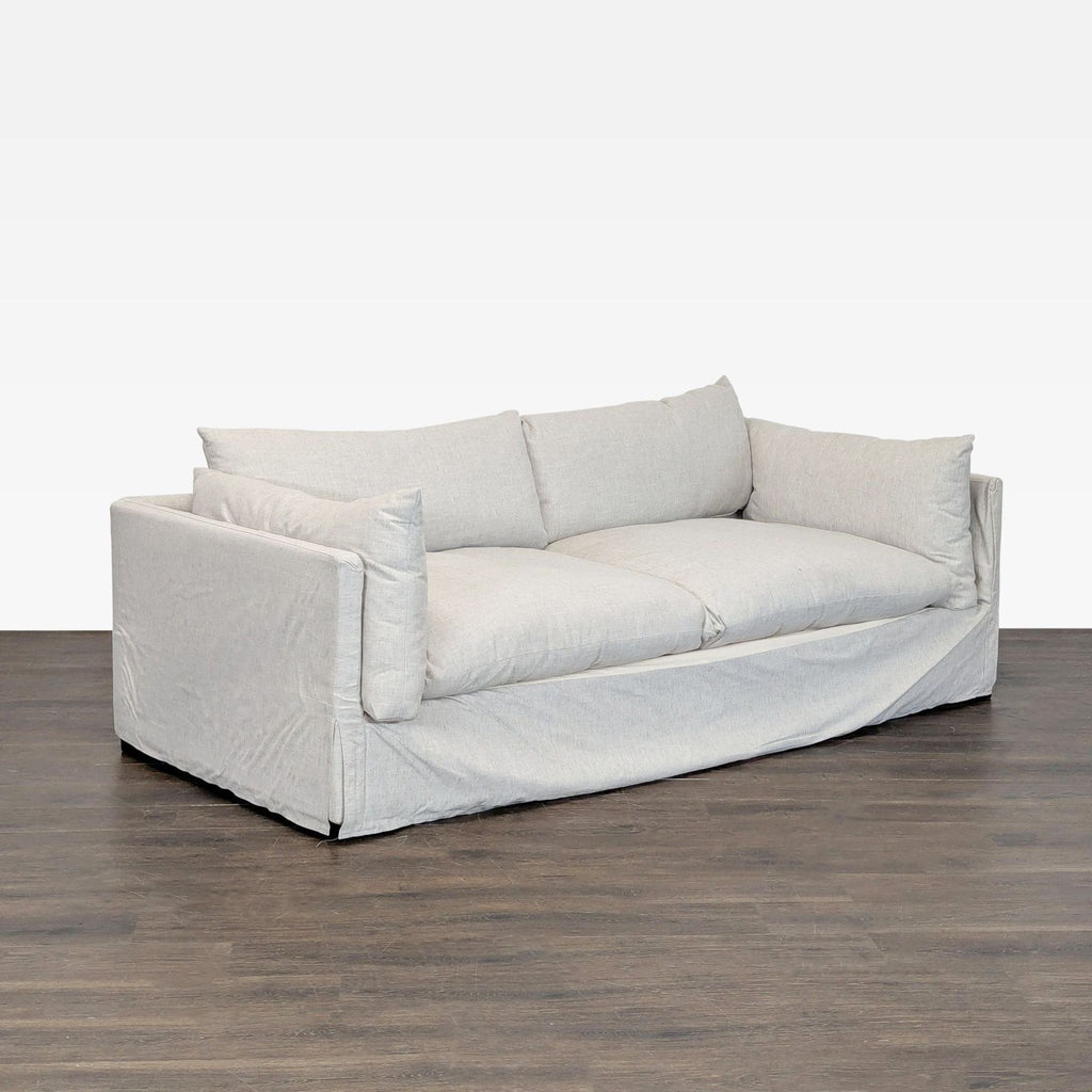 Neutral-colored Four Hands loveseat featuring a clean design, soft cushions, and sturdy build for everyday use.