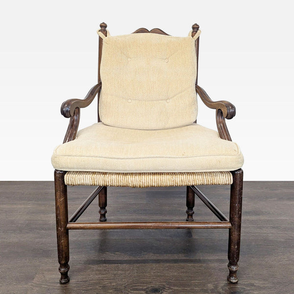 Rush seat dining chair with elegant scrolled arms, button-tufted back, and fitted seat cushion.